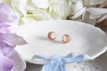 Pink knitted floral studs