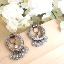 Staggering loop crystal earrings