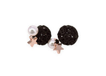 Black round studs with smiley face patterns